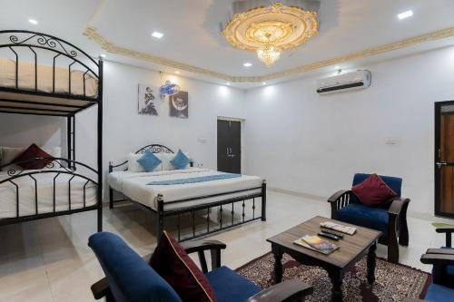 a bedroom with two bunk beds and a table at Emperor Palace A Heritage villa in Udaipur