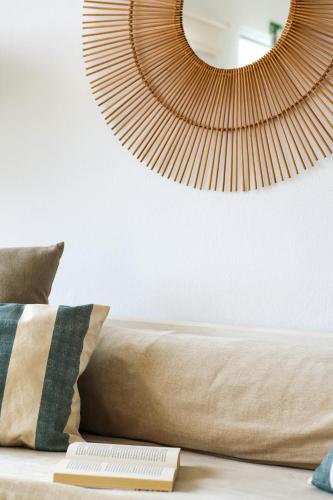 a bedroom with a bed and a mirror on the wall at Seashore Villa - Porto Santo in Porto Santo