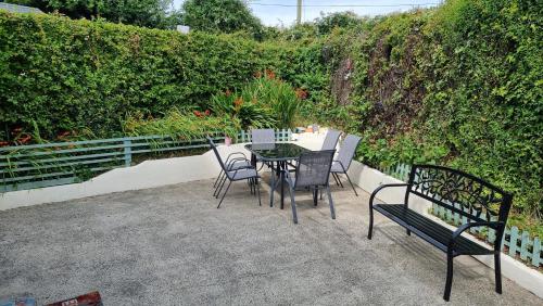 a table and chairs sitting on a patio at Curracloe Beach House in Curracloe