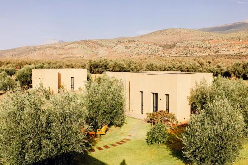 an overhead view of two buildings in a field with trees at Atlas Retreat Luxury Bed and Breakfast in Beni Mellal