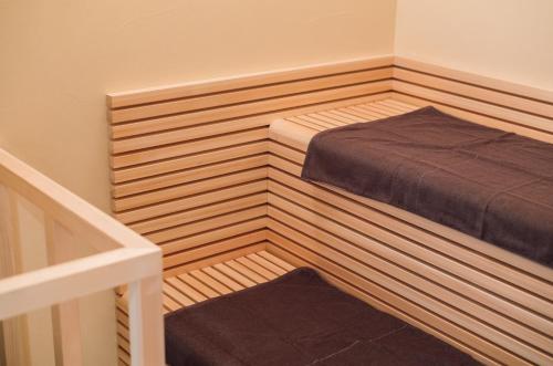 a small bedroom with a bed in a room at ACOA Villa Takashima in Takashima
