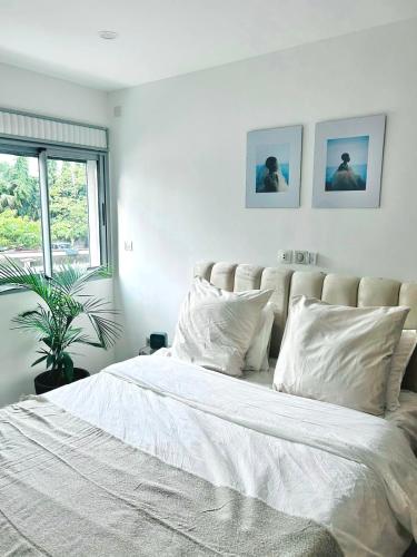 Llit o llits en una habitació de Charmant T2 a Cocody