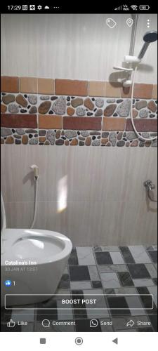 a bathroom with a tub and a sink in a room at Catalina`s Inn family room in Panglao