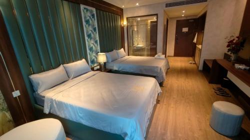 Ένα ή περισσότερα κρεβάτια σε δωμάτιο στο Apec Wyndham Luxe Escape Mui Ne