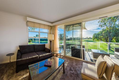 a living room with a couch and a table at The Sebel Swan Valley the Vines in The Vines