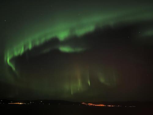 an image of the northern lights in the sky at Private House & Bungalow by the sea in Trondheim