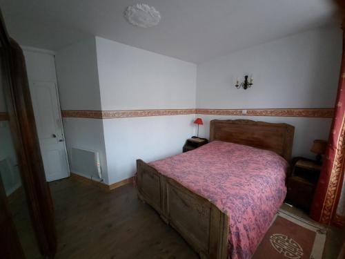 Ένα ή περισσότερα κρεβάτια σε δωμάτιο στο Maison de vacances