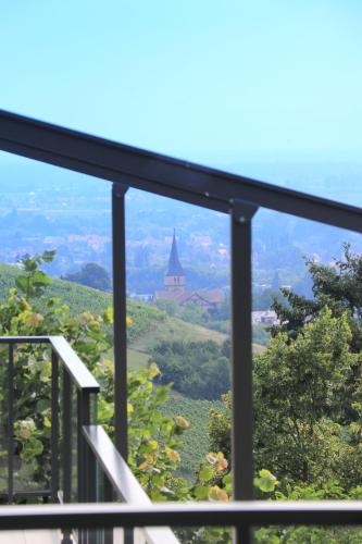 a view from a balcony with a view of a church at Alsace Panorama in Barr