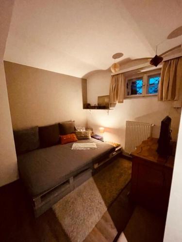 a small room with a bed and a window at 81 Weyer in Kirchberg am Wechsel