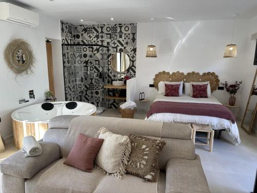 a living room with two beds and a couch at Suite lichi - benamahoma in Cuesta de la Palma