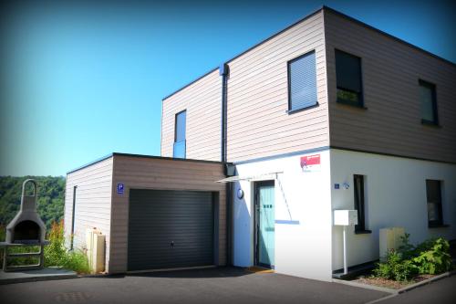 a large building with a garage with a door at Alsace Panorama in Barr