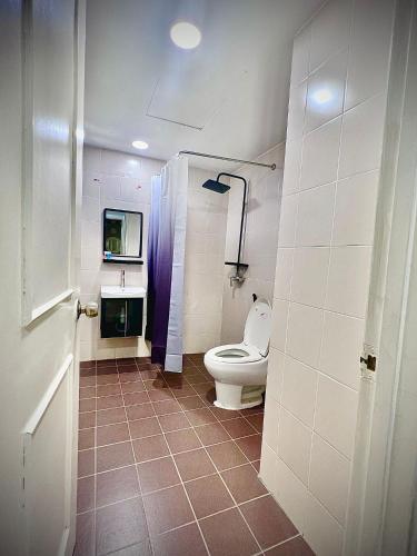 a bathroom with a toilet and a sink at D Savoy A Famosa 2 BR by Oasis in Kampong Pulau Sebang