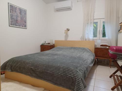 Katil atau katil-katil dalam bilik di Zeusplace Staliki cottage house