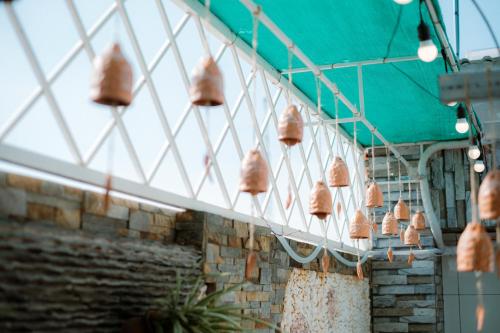 a group of baskets hanging from the side of a building at De Rivé Homestay Cần Thơ in Can Tho