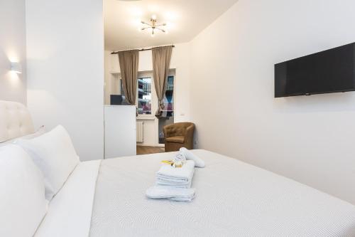 TV a/nebo společenská místnost v ubytování TRASTEVERE PALACE GUEST House