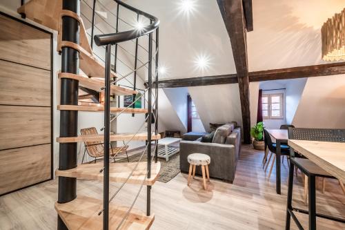 a spiral staircase in the living room of a loft conversion at Coeur vieille ville in Annecy