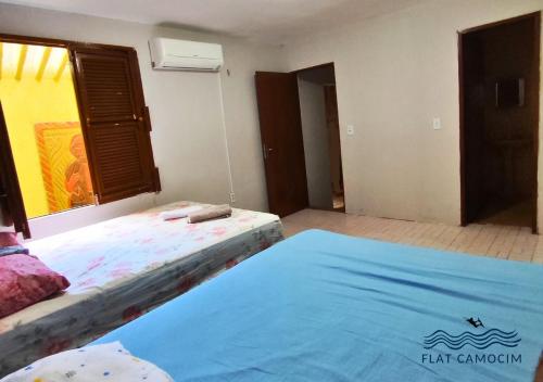 Letto o letti in una camera di Casa grande no centro em Camocim CE
