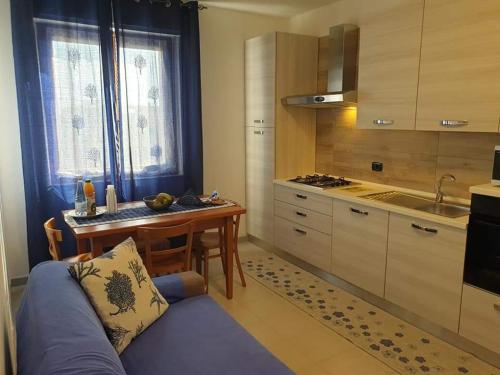 Kuchyň nebo kuchyňský kout v ubytování Gruppo Aedes Alghero, Residenza Michelangelo - 500 mt dalla spiaggia