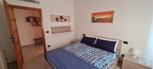 Postel nebo postele na pokoji v ubytování Gruppo Aedes Alghero, Residenza Michelangelo - 500 mt dalla spiaggia