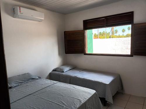 Postel nebo postele na pokoji v ubytování Casa de Praia em Ipioca - Maceió AL