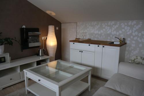 a living room with a coffee table and a couch at Villa Helia in Dolný Kubín