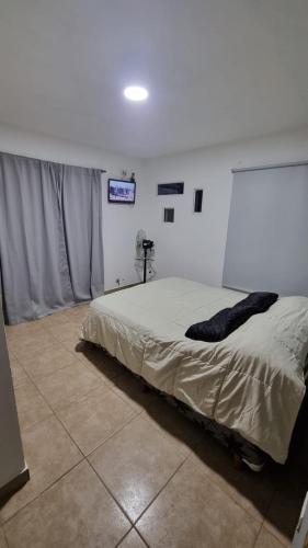 Ένα ή περισσότερα κρεβάτια σε δωμάτιο στο Lucila suites bosque