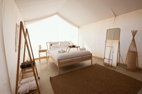 Katil atau katil-katil dalam bilik di Noor Glamping