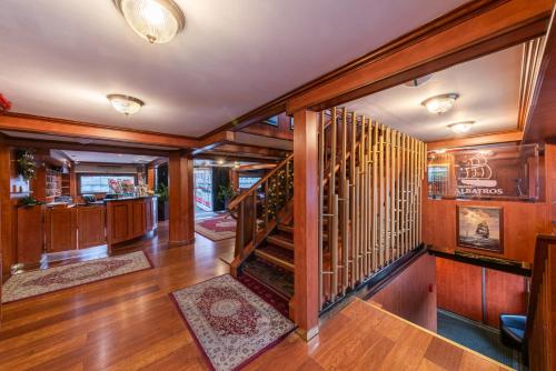 a hallway with wood paneling and a staircase in a house at Botel Albatros in Prague