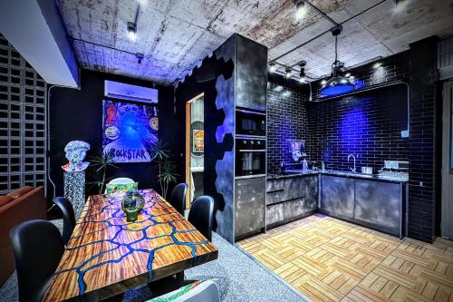 a dining room with a table and a kitchen at Z Loft Seaside FashionDesigner Loft in Bophut 