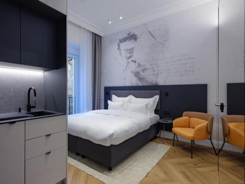 Ένα ή περισσότερα κρεβάτια σε δωμάτιο στο Fingerprint Art Apartments