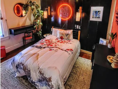 a bedroom with a bed with flowers on it at World Solo Travel's Welcomed At St Pete Home in St. Petersburg