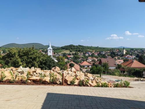 a view of a town with a church in the distance at Villa Zéta Wine & Spa in Mád