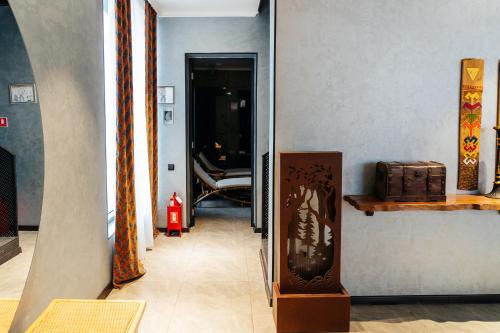 a hallway with a door leading into a room at SULO VIP Spa in Atyraū