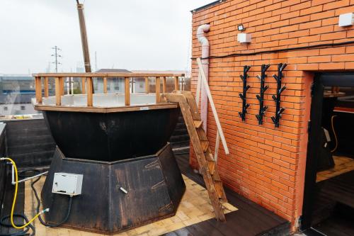 a boat sitting on the side of a brick wall at SULO VIP Spa in Atyraū