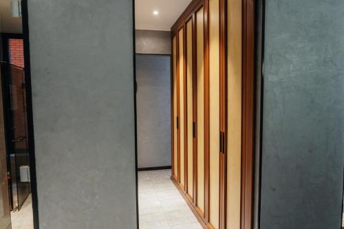 a hallway with sliding glass doors in a room at SULO VIP Spa in Atyraū