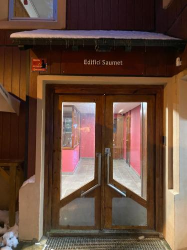 an entrance to a train station with a revolving door at Petit Baqueira 1500 a pie de pistas in Baqueira-Beret
