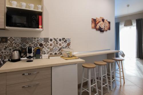 Η κουζίνα ή μικρή κουζίνα στο Tinellari Rooms