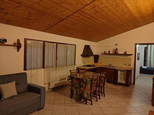 a living room with a couch and a table at Agriturismo Scuderia Castello in Gaino