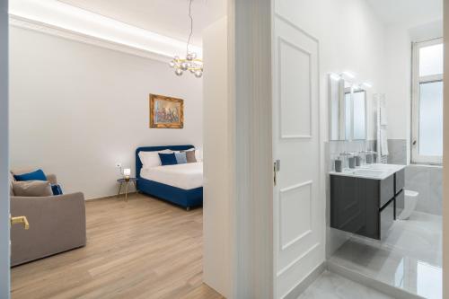 Ένα ή περισσότερα κρεβάτια σε δωμάτιο στο Palazzo Galeoni Luxury Suites