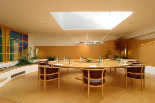 a conference room with a large table and chairs at IT Centrum Apartments in Vrchlabí