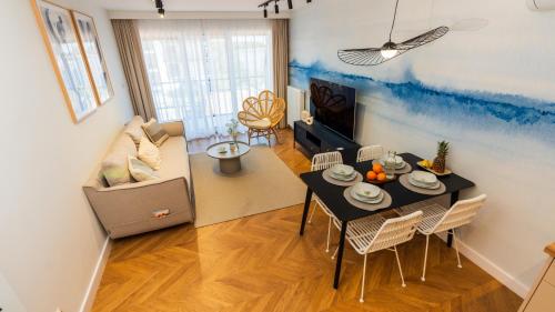Μια τηλεόραση ή/και κέντρο ψυχαγωγίας στο Apartament ODNOWA M29 basen i jacuzzi