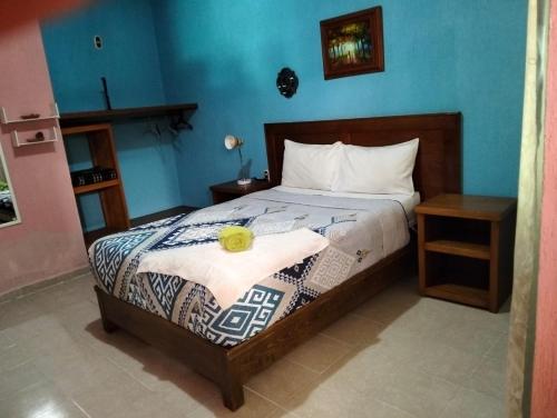 Postel nebo postele na pokoji v ubytování Hotel Tres Flores