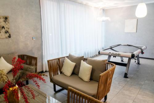 a hospital room with a bed and a couch at SULO VIP Spa in Atyraū