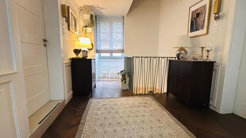 a hallway with a room with a radiator and a rug at Casa Cara in Birgu