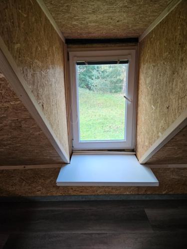 a window in the middle of a room at Baracek, Baraque in Horčápsko