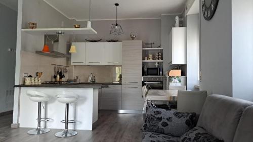 a kitchen with white cabinets and a counter top at Welcome home in Terni