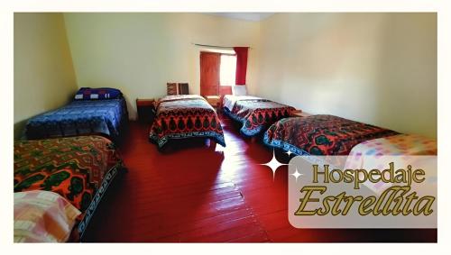 Ein Bett oder Betten in einem Zimmer der Unterkunft Hospedaje Estrellita