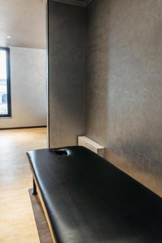 a black ping pong table in a room at SULO VIP Spa in Atyraū