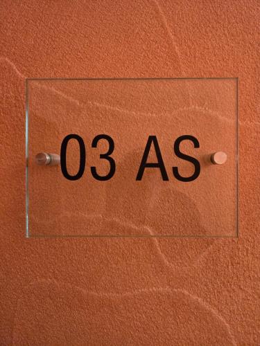 a sign with the number as on a wall at Apartament Sudecki in Karpacz