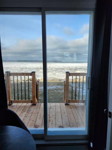 a view of the ocean from a window at Motel Rimouski in Rimouski